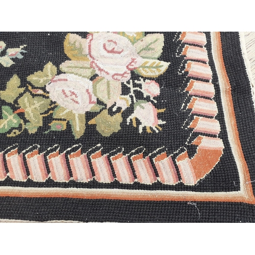 22 - A late 20th century black ground tapestry rug
Location: RAM