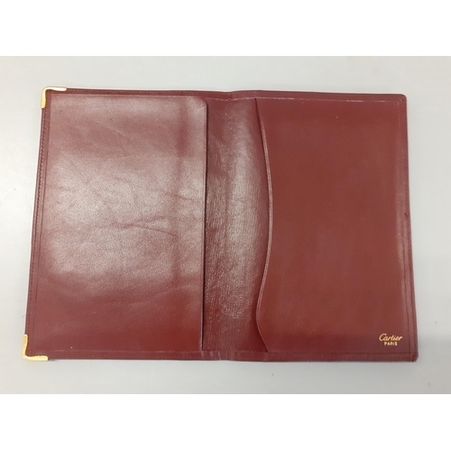 1 - Cartier-A Le Must de Cartier vintage burgundy leather and suede document folder with gold tone corne... 