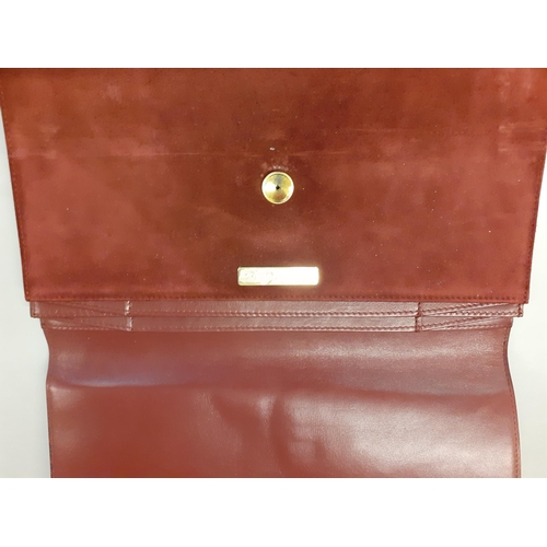 1 - Cartier-A Le Must de Cartier vintage burgundy leather and suede document folder with gold tone corne... 