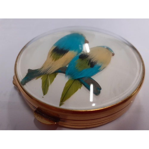 13 - Gucci-A vintage gold tone compact having a domed glass top over 2 feathered models of canaries, in o... 