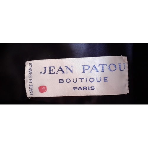 4 - Jean Patou Boutique, Paris-A late 20th Century black woollen and silk cocktail dress having a cross-... 