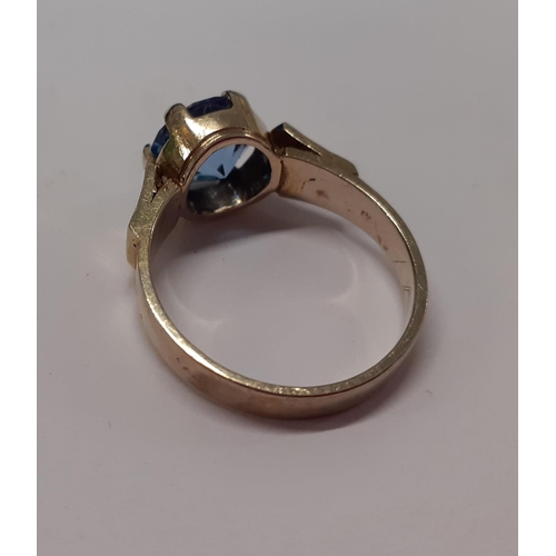 5 - A white metal ring, tests as 9ct white gold, having a turquoise cabochon on a raised mount, total we... 