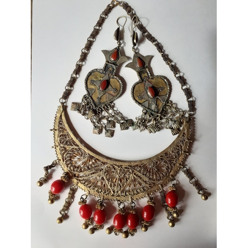 51 - A quantity of mainly Afghanistan and Turkmenistan jewellery to include white metal items inset with ... 