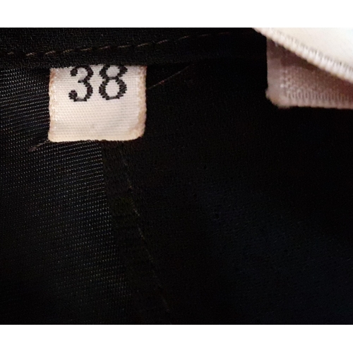 6 - Bob Bugnand, Paris- A black sleeveless cocktail dress with Paris label dating the dress between 1965... 