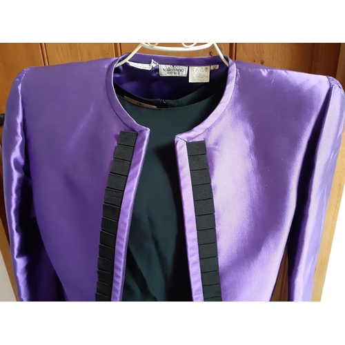 7 - Valentino Boutique- A purple silk 2 piece skirt suit having a vertical black ruffled trim to jacket ... 