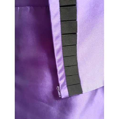 7 - Valentino Boutique- A purple silk 2 piece skirt suit having a vertical black ruffled trim to jacket ... 