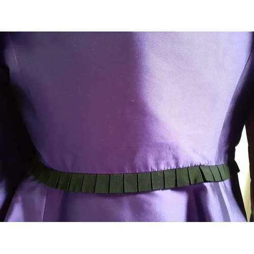 7 - Valentino Boutique- A purple silk 2 piece skirt suit having a vertical black ruffled trim to jacket ... 