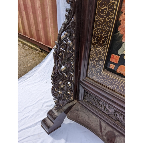 30 - A large Chinese hardstone, lacquer and hardwood screen, with central mythological battle scene, poss... 