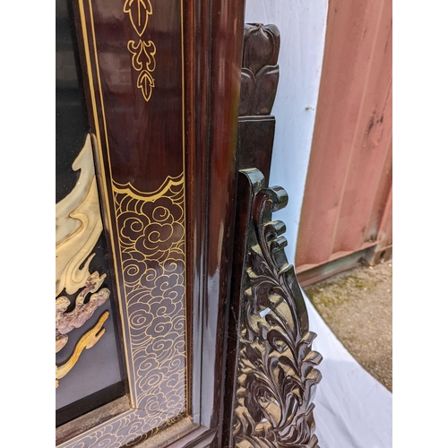 30 - A large Chinese hardstone, lacquer and hardwood screen, with central mythological battle scene, poss... 