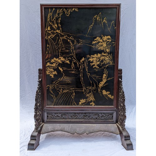 30 - A large Chinese hardstone, lacquer and hardwood screen, with central mythological battle scene, poss... 