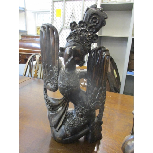 176 - Two Indonesian carved wooden statues
Location: 10.1