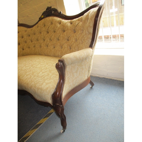 198 - A Victorian carved mahogany, button back upholstered settee, two tone cream fabric with floral scrol... 