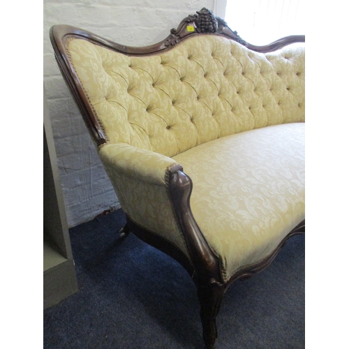 198 - A Victorian carved mahogany, button back upholstered settee, two tone cream fabric with floral scrol... 