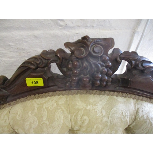 198 - A Victorian carved mahogany, button back upholstered settee, two tone cream fabric with floral scrol... 