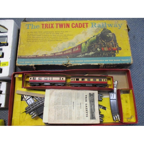 270 - Two Hornby 00 gauge carriages, Trix Twin and a vintage telephone painted yellow and green Location: ... 