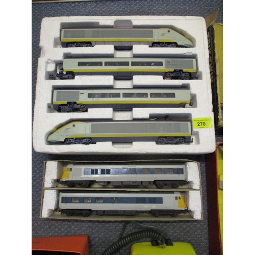 270 - Two Hornby 00 gauge carriages, Trix Twin and a vintage telephone painted yellow and green Location: ... 