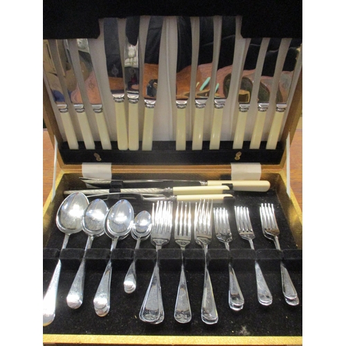 287 - A chrome nickel plated cutlery set, a green leather and brass bound jewellery box, a London Clock Co... 