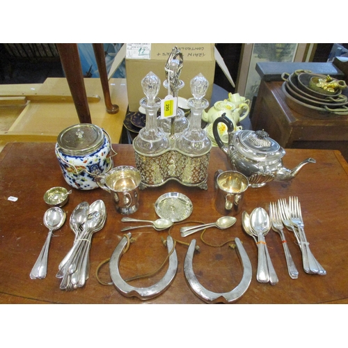 290 - A quantity of Victorian and later silver plated items to include a three-bottle decanter set in hold... 