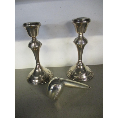 291 - A pair of silver candlesticks, London 1976 marks probably for Broadway & Co (filled) 681.9g, and a s... 