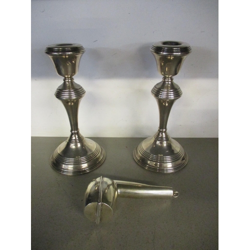 291 - A pair of silver candlesticks, London 1976 marks probably for Broadway & Co (filled) 681.9g, and a s... 