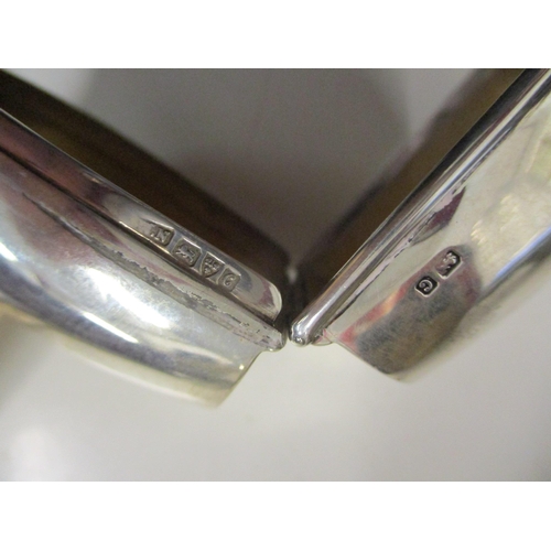 291 - A pair of silver candlesticks, London 1976 marks probably for Broadway & Co (filled) 681.9g, and a s... 