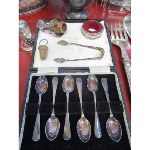 74 - A selection of silver and silver plated items to include a silver three piece cruet set, cased silve... 