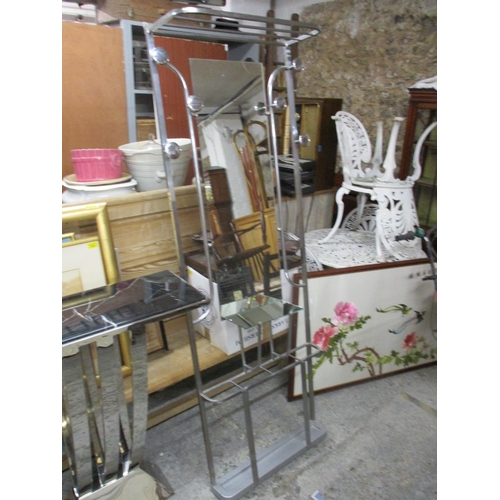 80 - A brushed silver finished hall stand in the modernist style with coat hooks and mirrored shelf and b... 