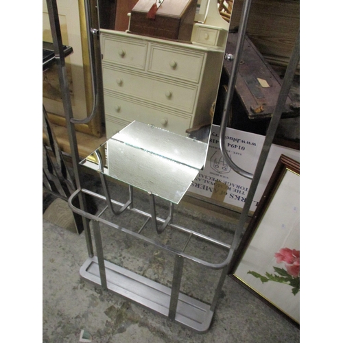 80 - A brushed silver finished hall stand in the modernist style with coat hooks and mirrored shelf and b... 