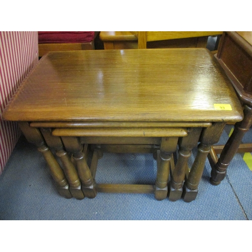 93 - A mid 20th century nesting set of three oak tables, 48cm h x 59cm w and a modern mahogany single dra... 