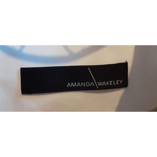 19 - Amanda Wakeley-A cream cotton formal box jacket with cream silk lining and trim, UK size 14. Locatio... 