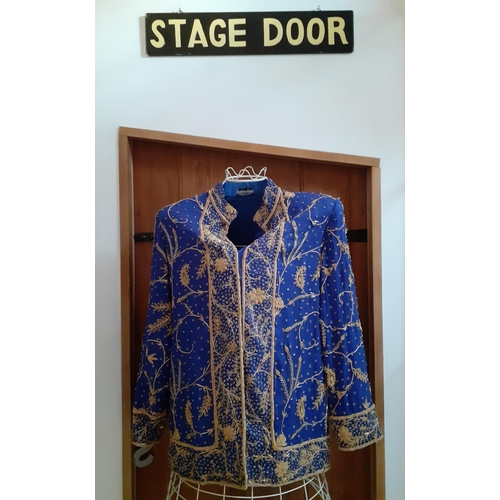 32 - An Indian blue ground cotton evening jacket by Burlington, Bombay, having gold metallic thread detai... 