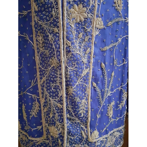 32 - An Indian blue ground cotton evening jacket by Burlington, Bombay, having gold metallic thread detai... 