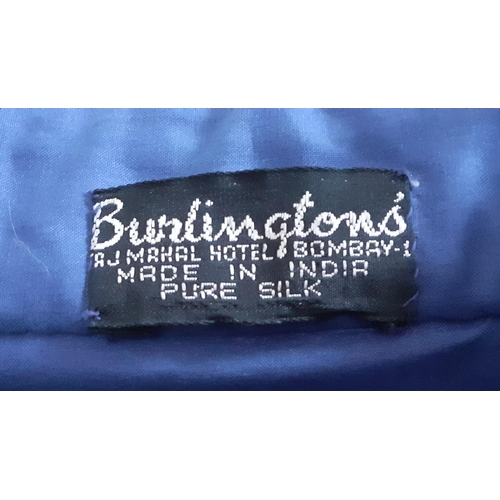 32 - An Indian blue ground cotton evening jacket by Burlington, Bombay, having gold metallic thread detai... 