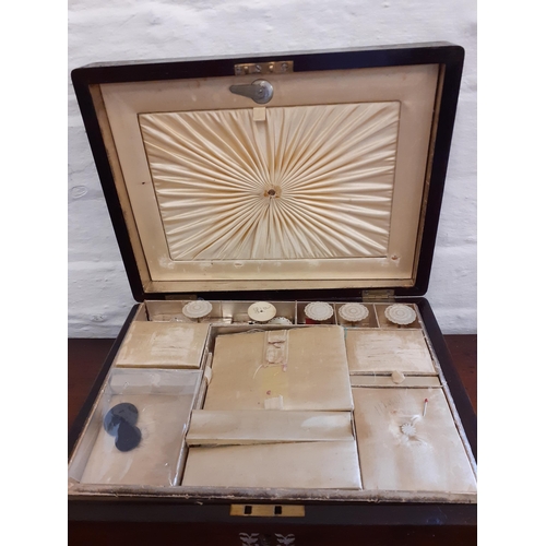 46 - A 19th Century rosewood and inlaid sewing box with fitted compartments, mother of pearl cotton reels... 