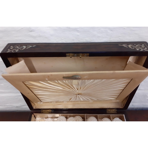 46 - A 19th Century rosewood and inlaid sewing box with fitted compartments, mother of pearl cotton reels... 