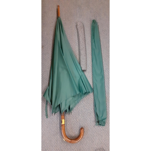 59 - An Edwardian Briggs green umbrella, Circa 1911 with incorporated racing pencil, refurbished by Brigg... 