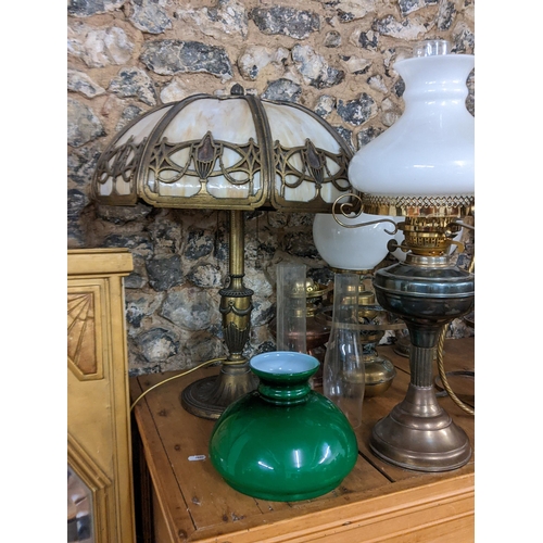 154 - A selection of oil lamps, together with a French style table lamp
Location: G