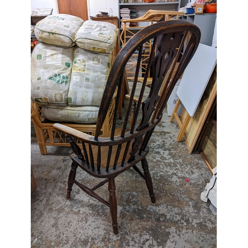 16 - A 19th century Windsor elm and ash armchair having spindle supports and turned legs
Location: G