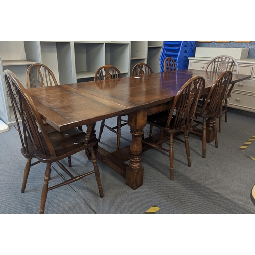 187 - A reproduction stained oak refectory extending dining table 259cm w (when extended) x 75.5cm h x 91c... 