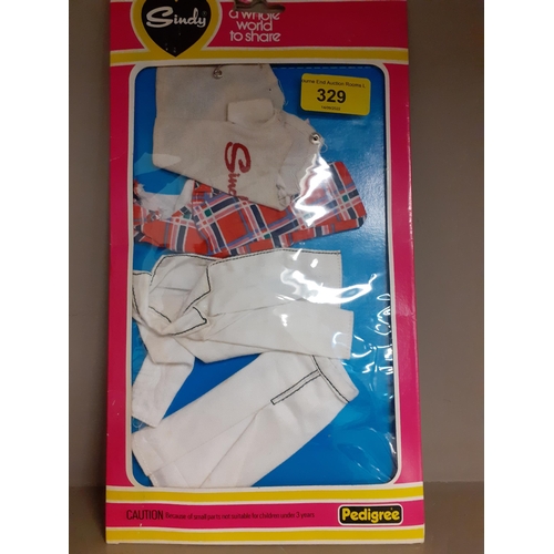 329 - A 1980's Sindy doll in original box with clothing accessories
Location: R2.2