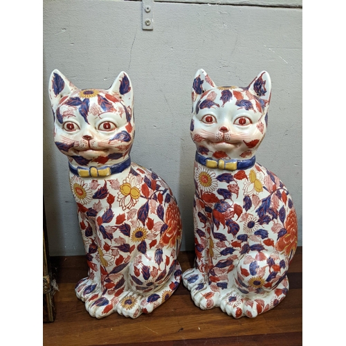 336 - A pair of Japanese Imari models of seated cats, together with a framed print Location:BWR