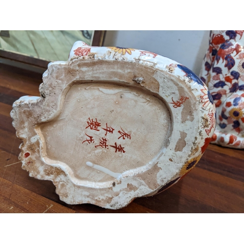 336 - A pair of Japanese Imari models of seated cats, together with a framed print Location:BWR