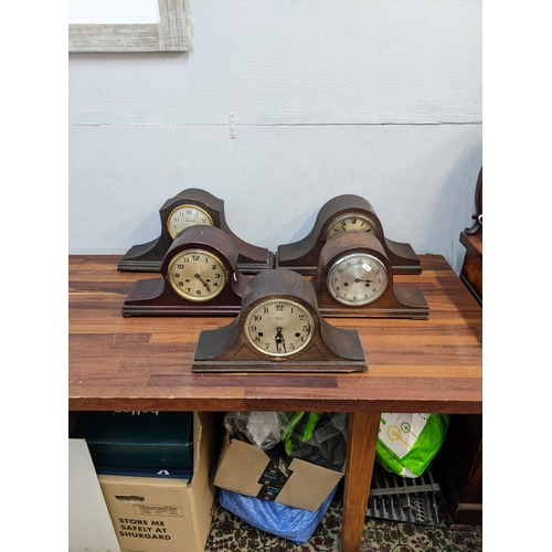 34 - A selection of early/mid 20th century Napoleon hat mantle clocks, together with an oak cased 8 day g... 