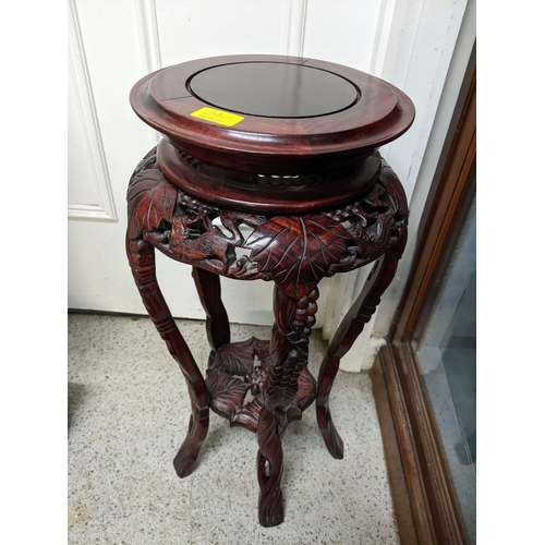 340 - A late 20th century Chinese hardwood jewellery cabinet with a hinged top and two drawers along with ... 