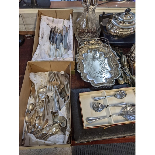 341 - A mixed lot of silver plate to include a caret jug, muffin dish, tankards, cutlery, teapot, trays an... 