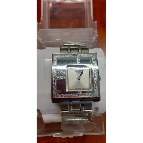 375 - A silver tone and square dial Swatch watch in original case together with an early 21st century yell... 