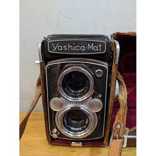 51 - Mixed cameras, binoculars and accessories to include a Yashica-Mat camera
Location: RWF