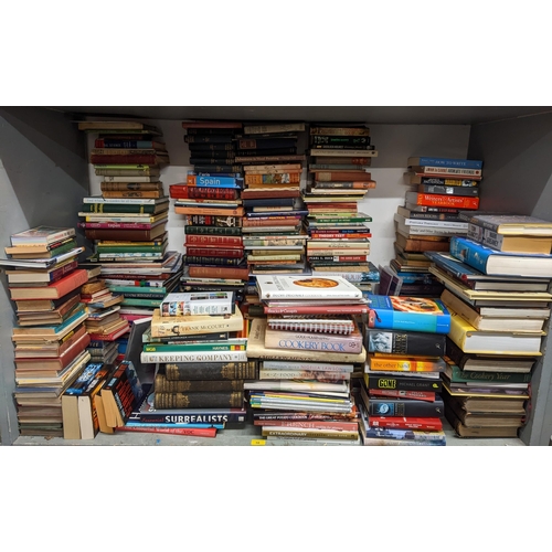 58 - A large selection of books to include Harry Potter, cook books, Tom Clancys, Astronomy books and oth... 