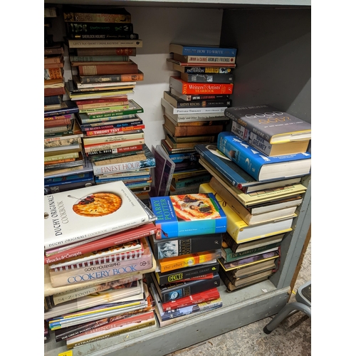 58 - A large selection of books to include Harry Potter, cook books, Tom Clancys, Astronomy books and oth... 