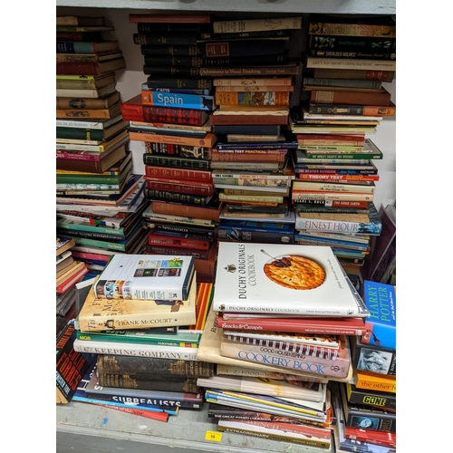 58 - A large selection of books to include Harry Potter, cook books, Tom Clancys, Astronomy books and oth... 